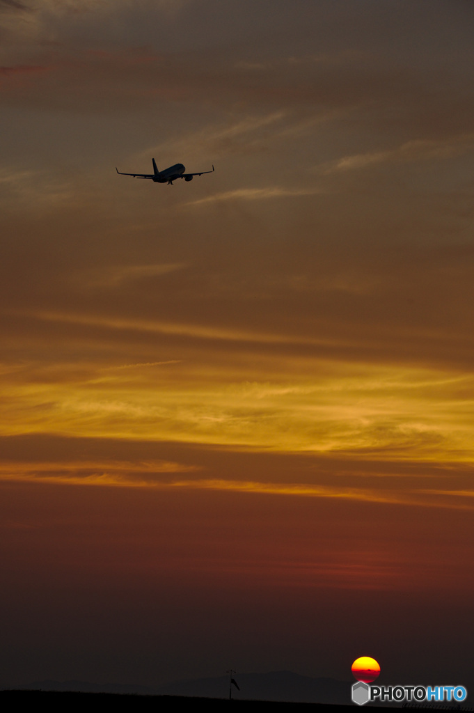 沈む夕日を越えて