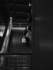 A woman at the stairs.
