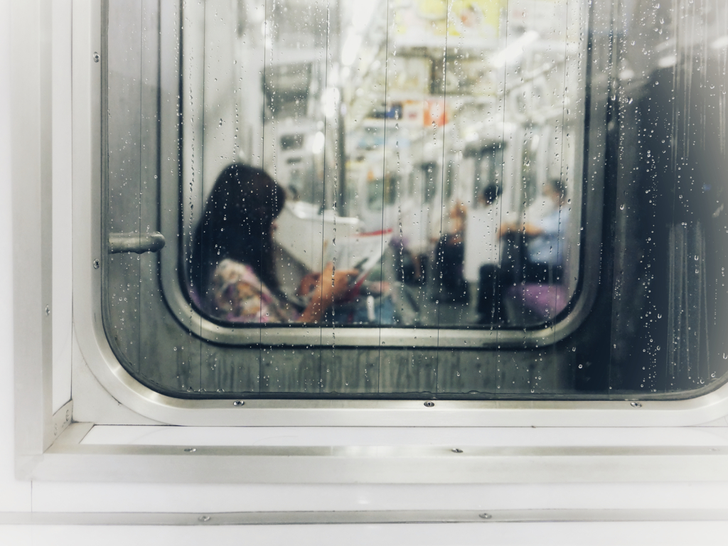 A woman beyond the train window.