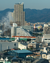 オレンジー高層ビルをバック