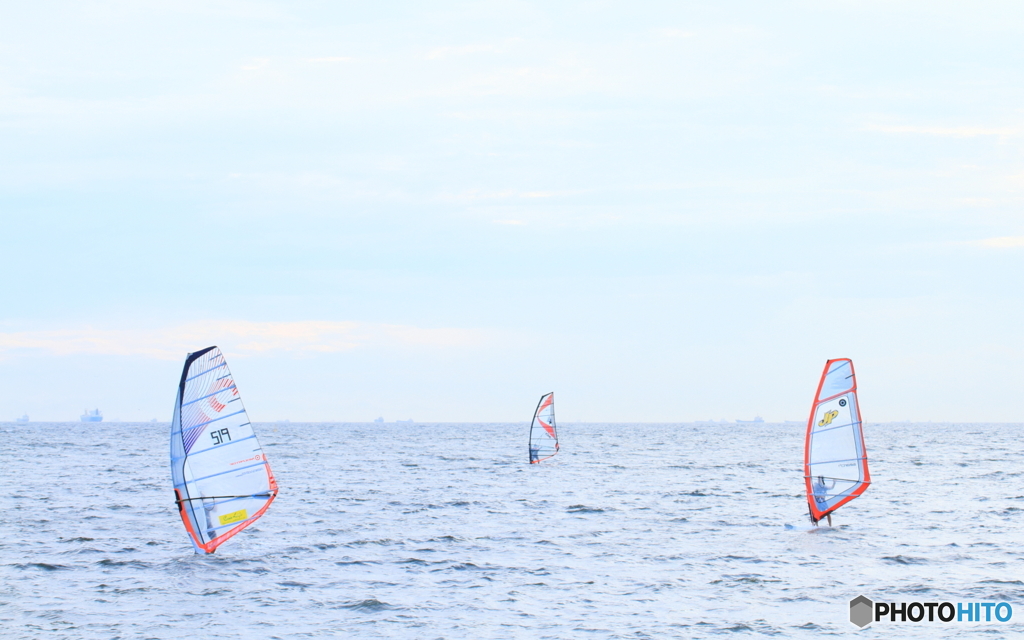 Three orange sails