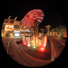 Colorful fountain and big wheel