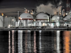 Spheres in industrial area at night.
