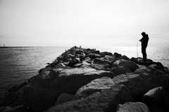 A fisherman at the jetty