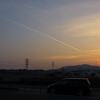 夕陽と飛行機雲