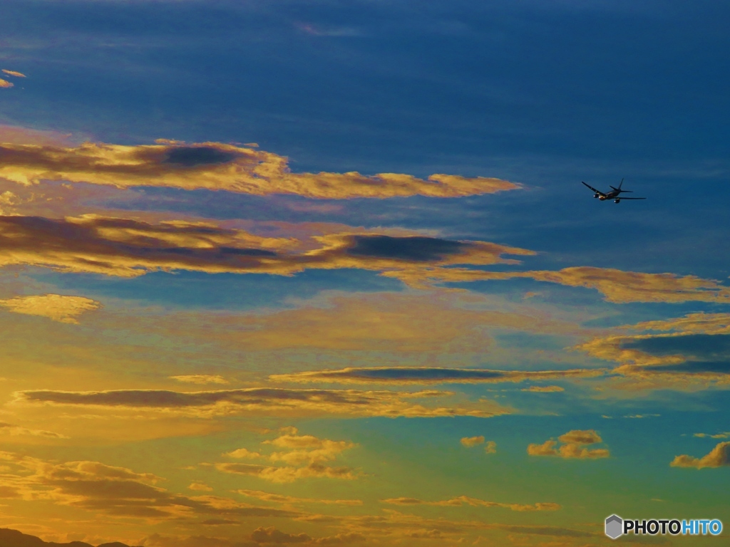 夕焼けの空へ