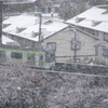 雪の中を走る京王線