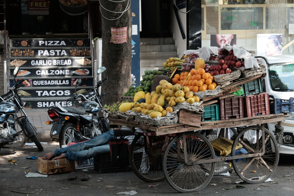 Fruit shop with sleeping master