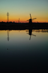 windmill and electric poles