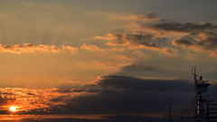 The setting sun illuminates the ship