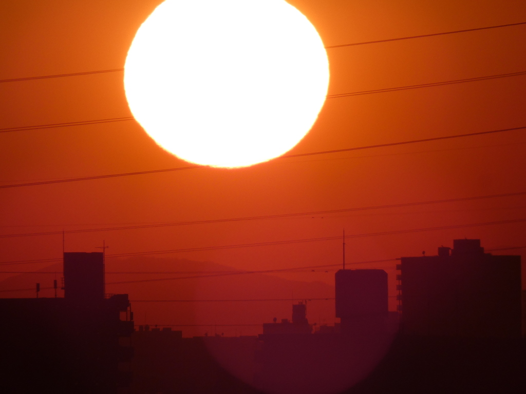 千住新橋から徳右衛門岳上空の夕日