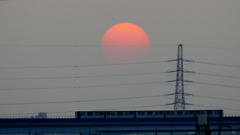 夕日春霞に負ける