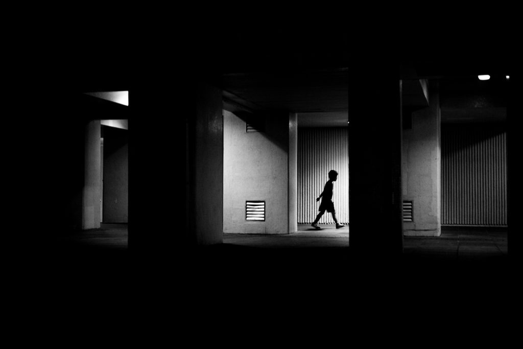 A boy between light and shadow