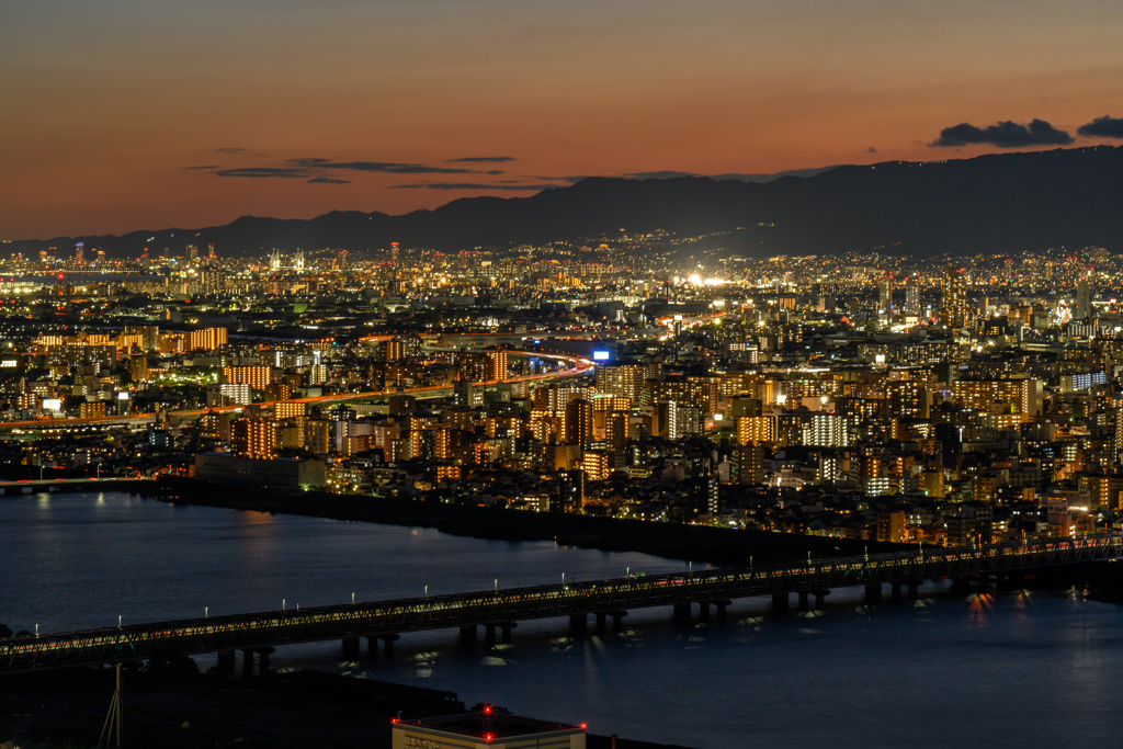 Bridge and the city in the twilight