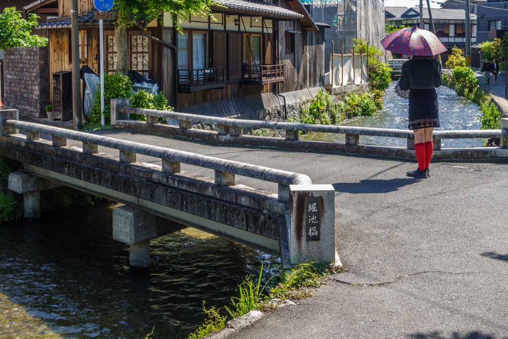 Woman standing on a bridge