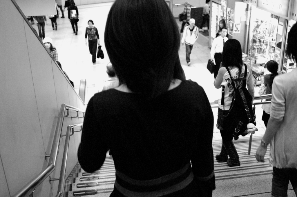 From behind