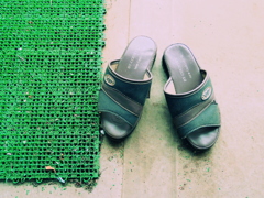 Sandals and a green mat