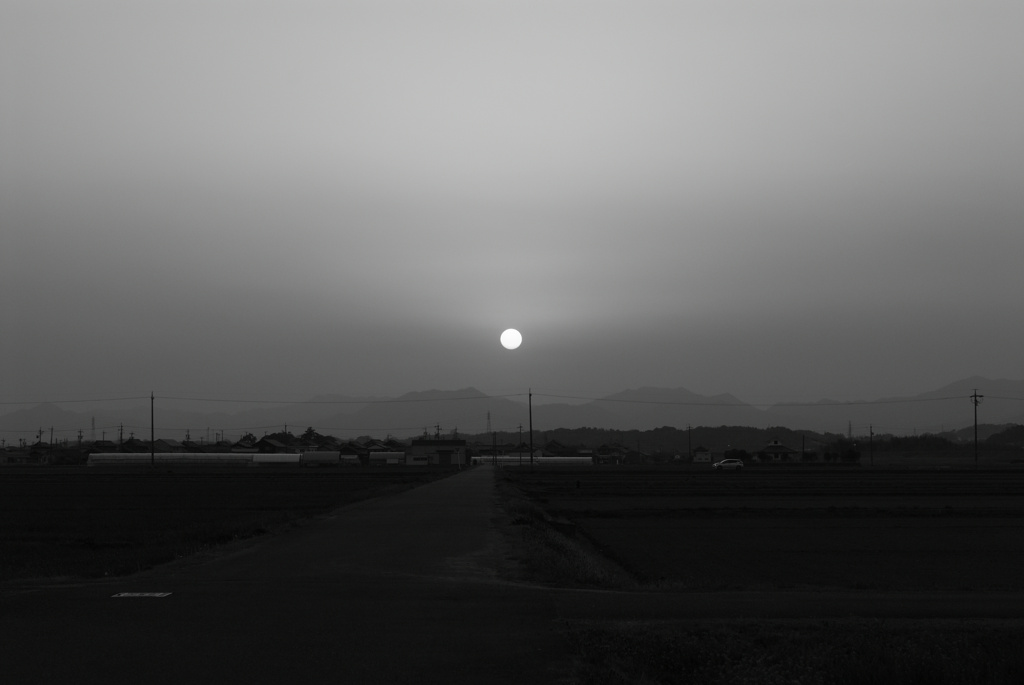 黄砂に夕日