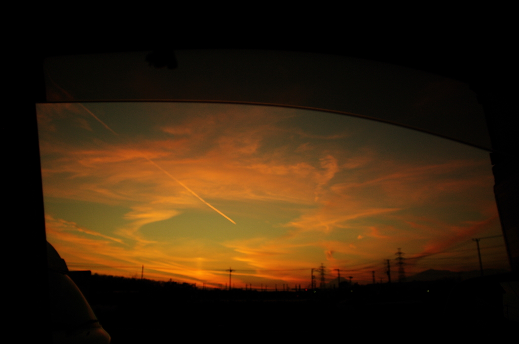 車窓からの夕陽…