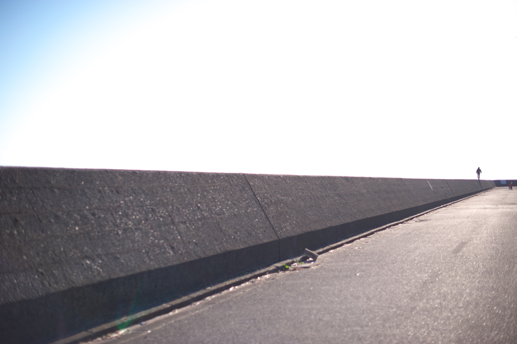 a man on the breakwater