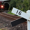 １６