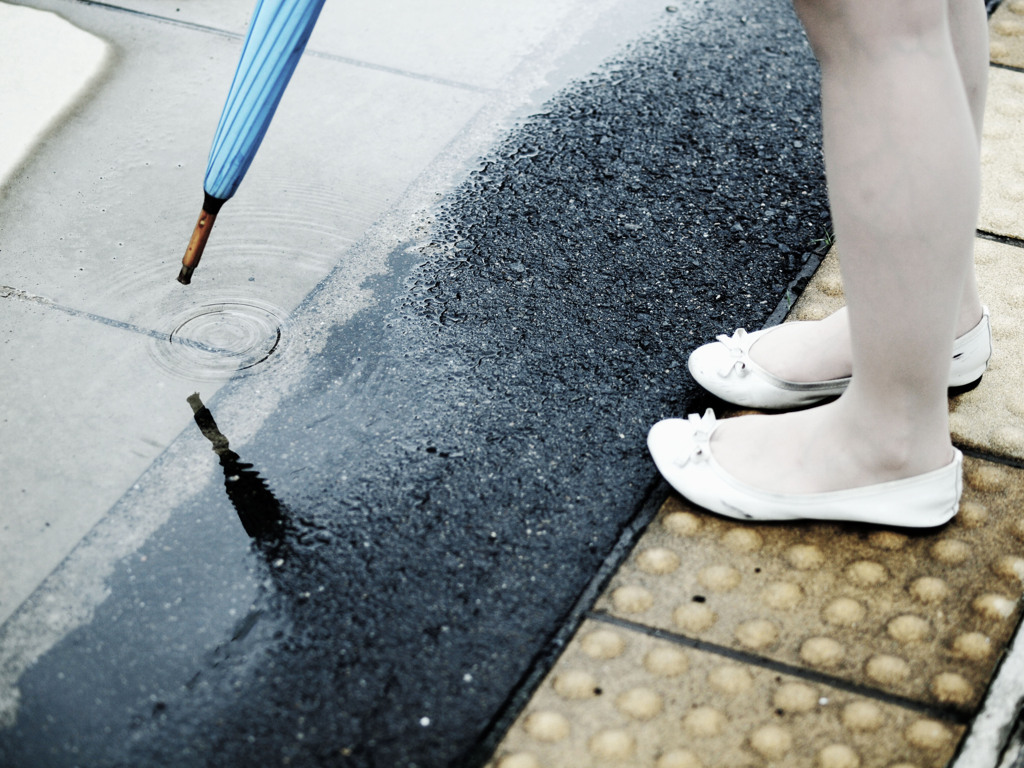 Puddles and umbrella.