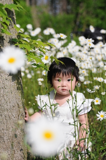 She is standing in flowers