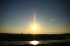 十勝川に映る夕日