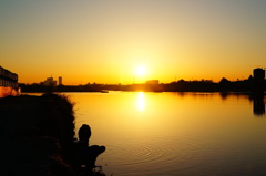 Rising sun and anglers