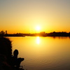 Rising sun and anglers