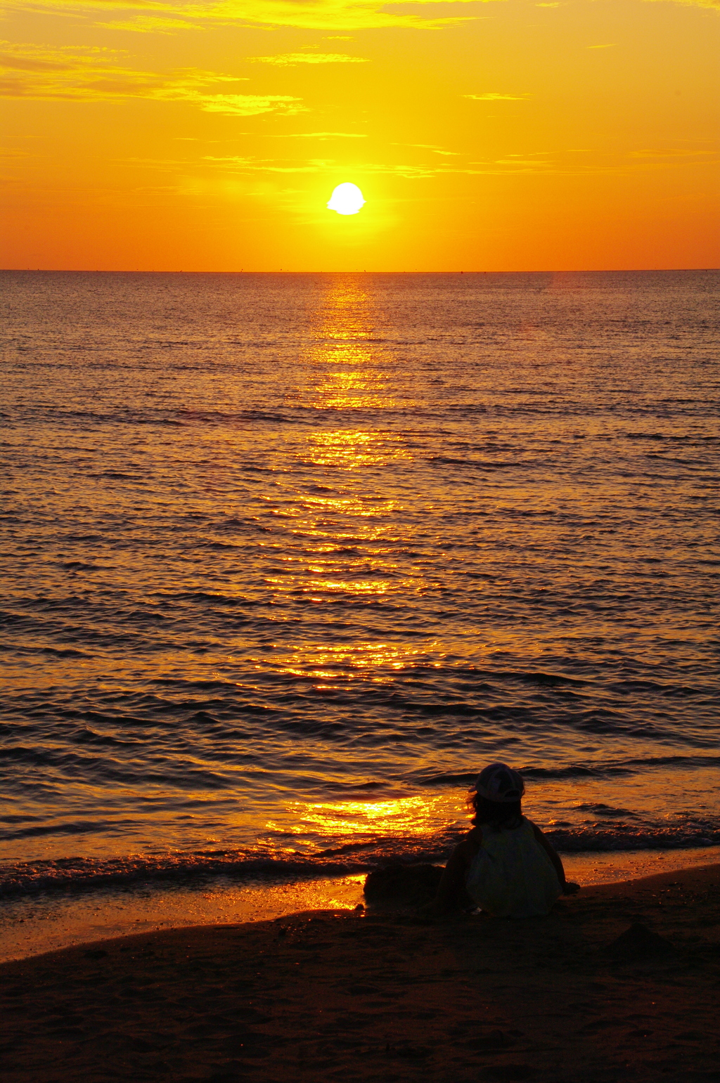 夕焼けと砂浜と心残り