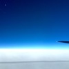 月と飛行機雲の影