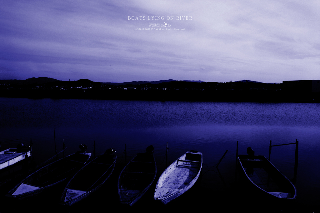 BOATS LYING ON RIVER