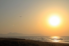 夕日の空へ