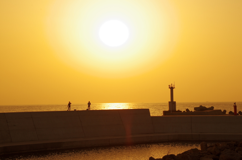 釣り人と夕日