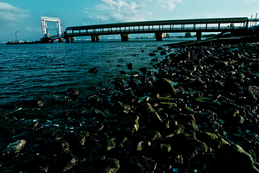 a small bridge floating on the sea.