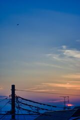 夕日と雲とヘリコプター