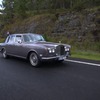 an old Rolls-Royce with Australian flags