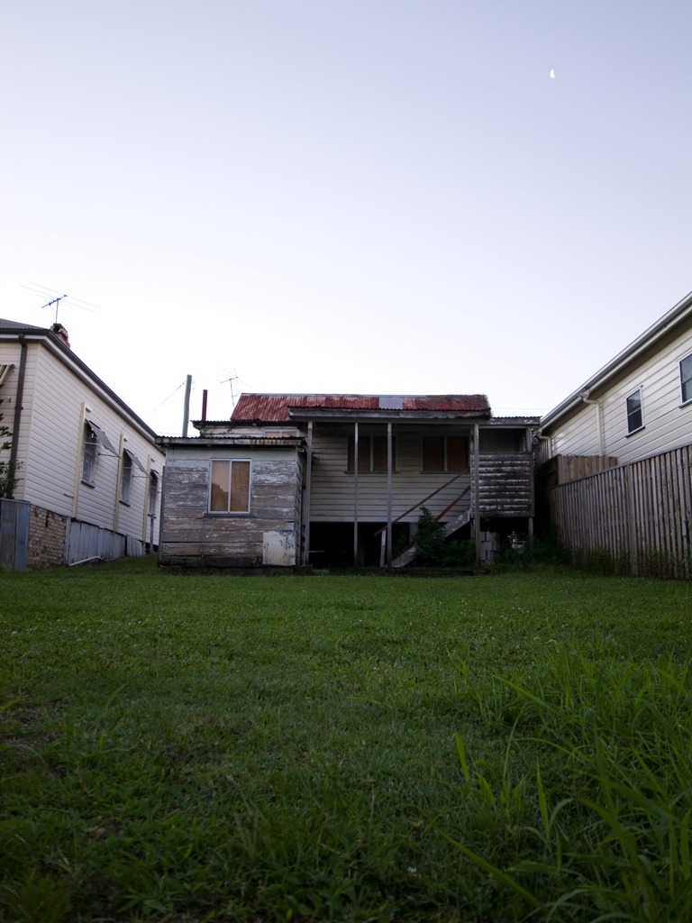 a vacant house with the moon