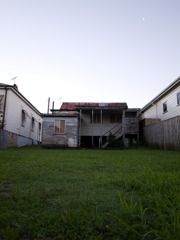 a vacant house with the moon