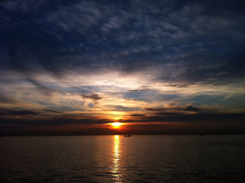 The Sun Setting On A Skyline