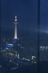 Kyoto Tower reflects to the window.
