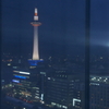 Kyoto Tower reflects to the window.