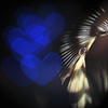 The heart that is blue on a feather