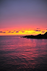 The flame sky purple sea