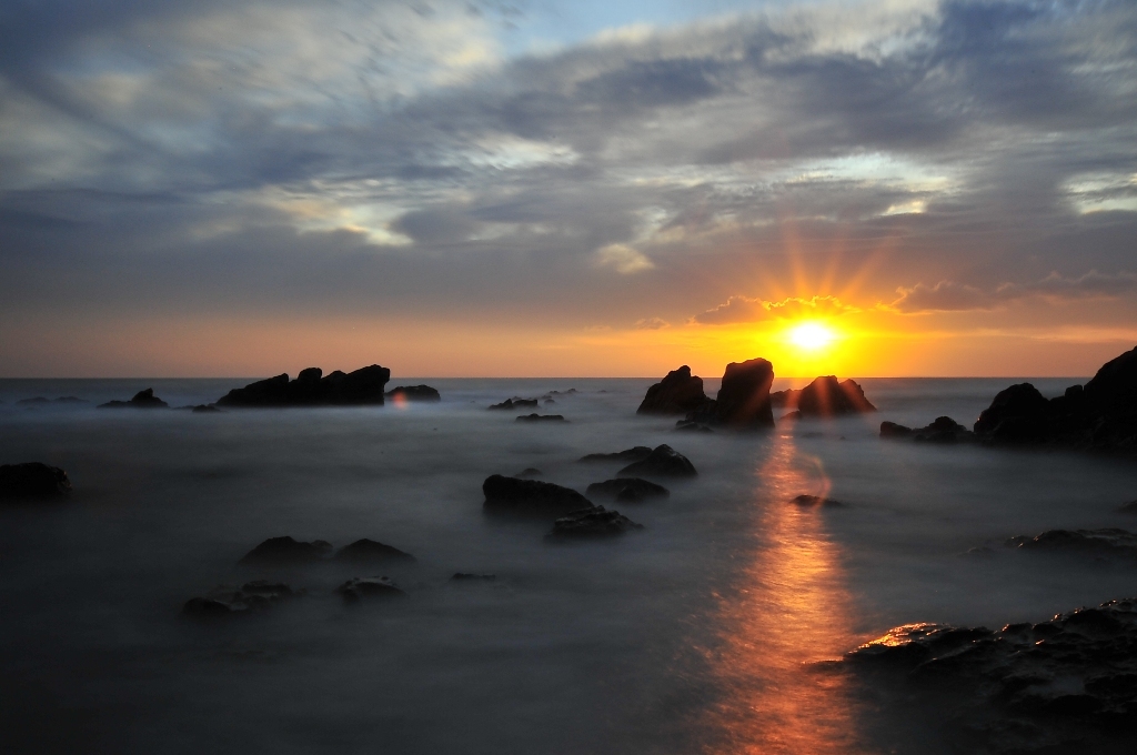 Shaft of flare light on the sea