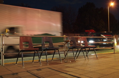 Chairs beside road.