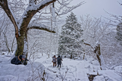 Hunters aim at a target in the Snow