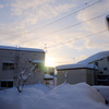 雪かき中に見た朝日