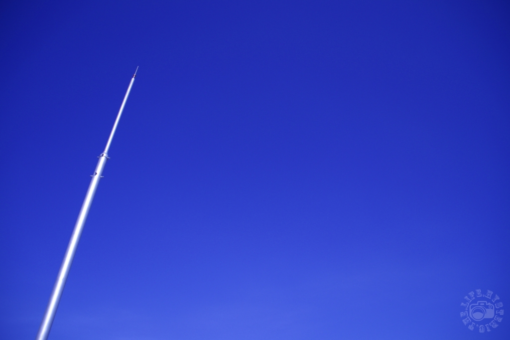 Blue sky and lightning rod